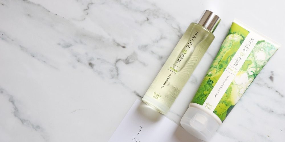 Malée Natural Science New Year Resolutions Malée Natural Science New Year Resolutions 100ml Verdure Moisturising Oil 200ml Verdure conditioning Body Cream both bplaced close to a white paper on which a word January is written