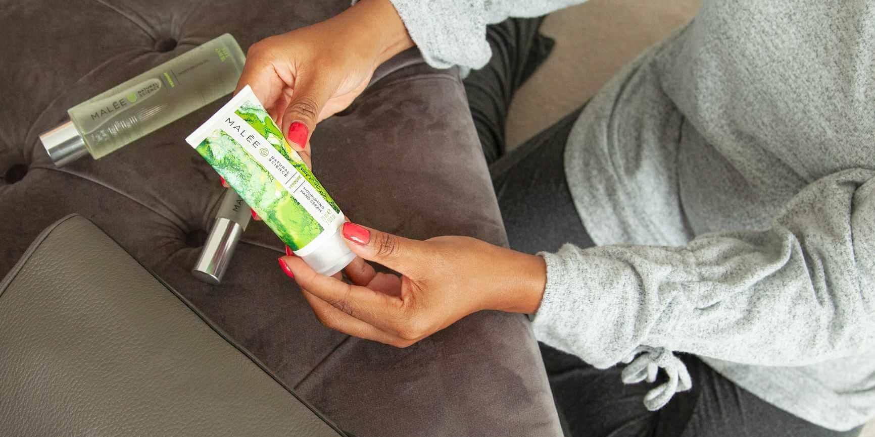 Malée Natural Science Zeze holding Moisturising Oil and Hand Cream