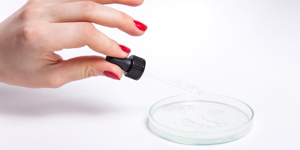 Oils-with-hand (1) Malée Natural Science - Oils with hand