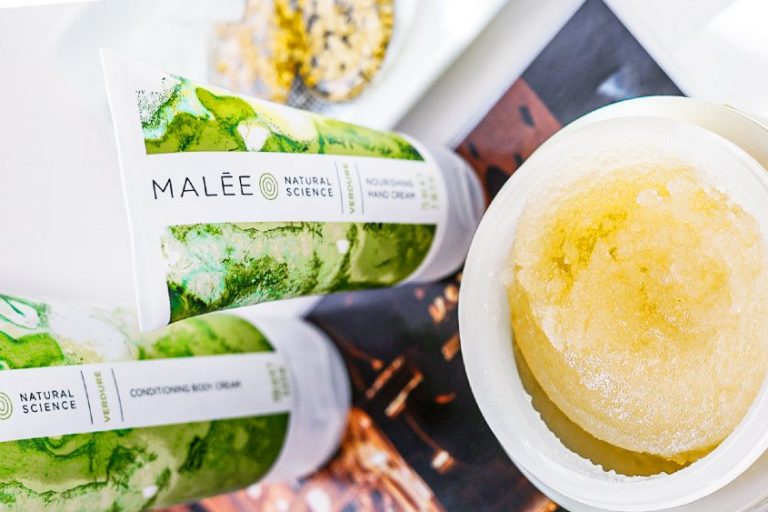 BHAs Malee Natural Science Set on a golden light book cover are the Malee 200ml verdure Conditioning Body Cream with the 75ml Nourishing Hand cream next by an open 250ml Conditioning Body scrub
