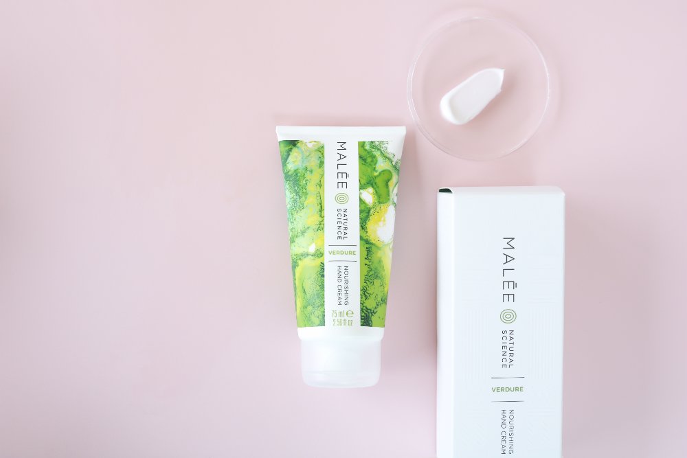 Malée Natural Science 75ml Verdure Nourishing hand cream with a white background and cream pasted in clear glass and   