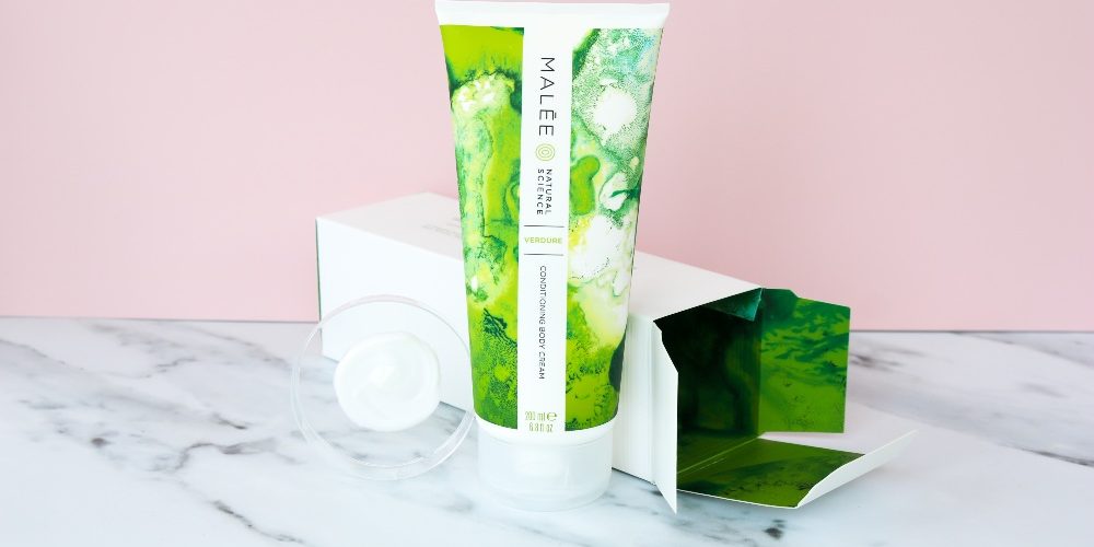 Skincare-ingredients-to avoid-pregnant-Malée-Natural-Science skincare ingredients to avoid pregnant Malée Natural Science 200ml Verdure Conditioning Body Cream next to its outer box with a tester on a marble counter