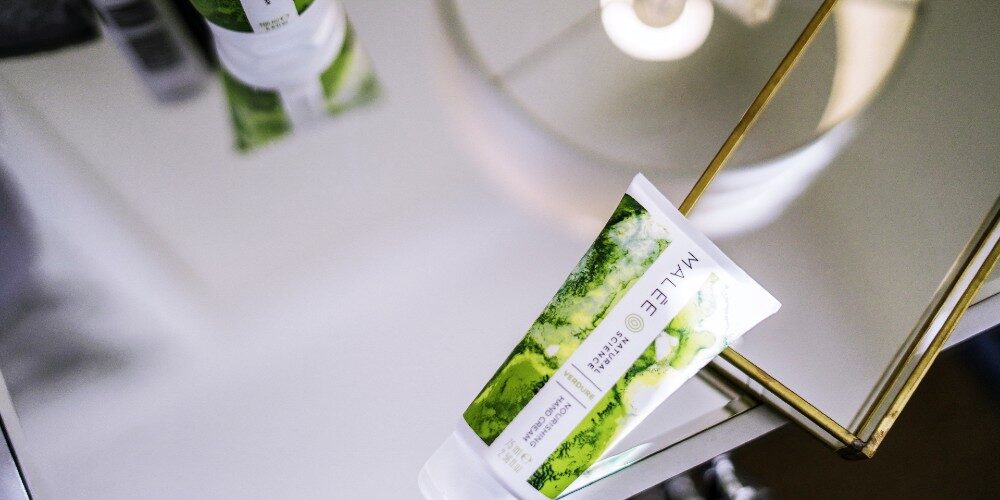 Best hand cream for wrinkles The 75ml Verdure Nourishing Hand cream set opposite the 200ml Verdure Conditioning Body Cream. Both placed on a silver Side bed table., with the lighting reflecting through