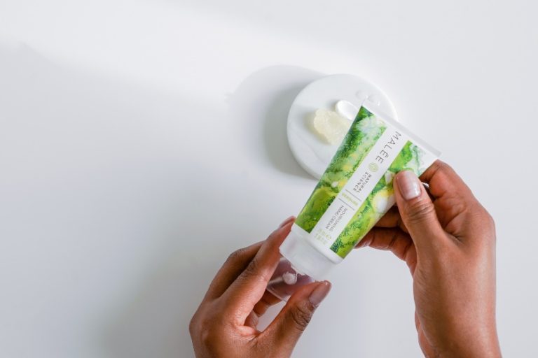 What Hand Cream is best for Eczema Malee Natural Science, Female hands holding a 75ml Verdure Nourishing Hand Cream, Next to it, a tester pallet of the same hand cream and Verdure Moisturising Body Scrub